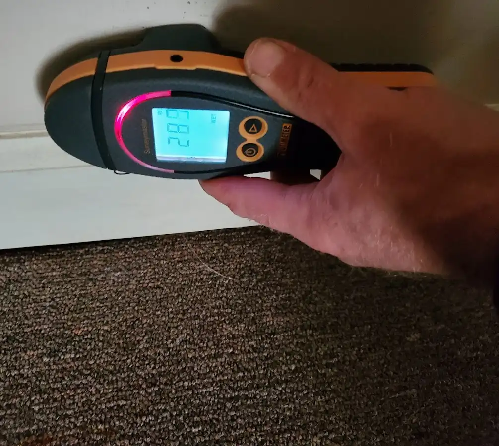 Moisture detection at baseboard during Storm Damage Restoration in Valparaiso